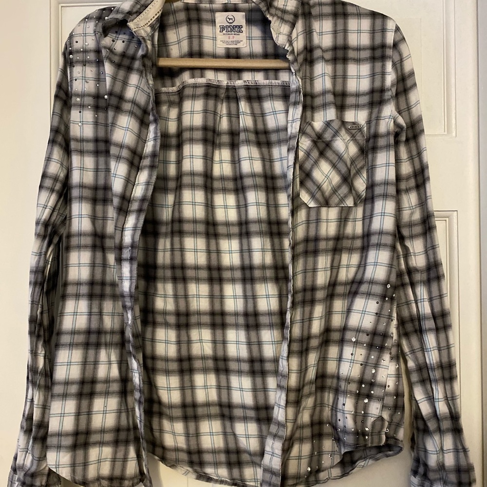 Long sleeved, flannel with rhinestones.